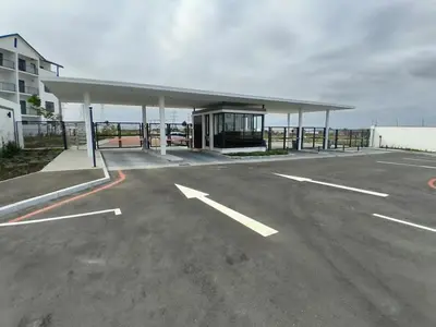an empty parking lot with a large building at Cosy spot in Blackheath