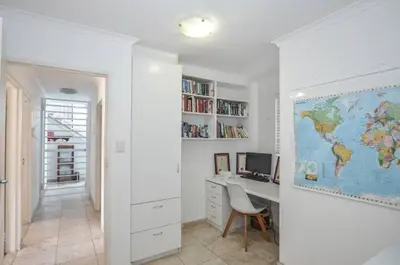 a home office with a desk and a world map at Large 4 Bedroom Villa with Pool in Cape Town