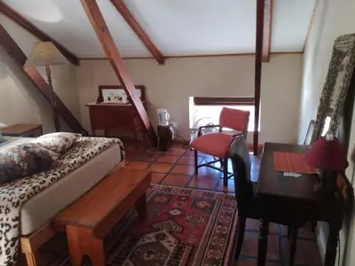 a living room with a couch and a table at House On Plein in Paarl