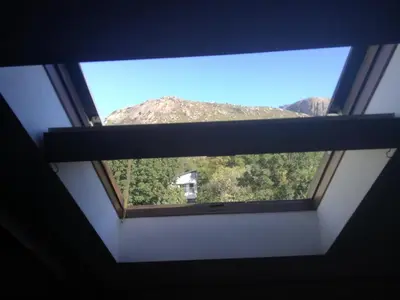 a window in a room with a view of a mountain at House On Plein in Paarl