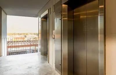 a elevator in a building with a balcony at The Hideaway on Moringa Way in Cape Town