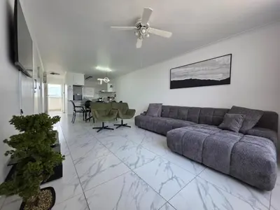 a living room with a couch and a table at 607 Odean - Luxury Ocean Escape in Strand