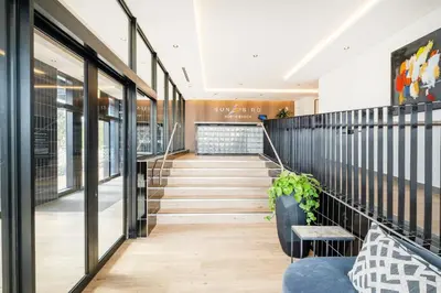a staircase in a building with a lobby at 404 Riverlands - Studio Apartment with Parking in Cape Town