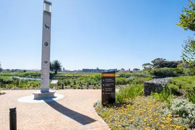 a sign in front of a monument in a garden at 207 Riverlands - 1 Bedroom Apartment with Parking in Cape Town