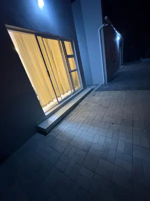 an empty room with a window in a building at night at Immaculate,Alttrative &Modern 6 minutes away from the beach in Cape Town