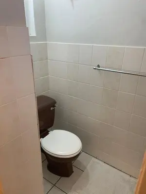 a bathroom with a toilet in a stall at Sunset sea views - 4 bedroom home in Hermanus
