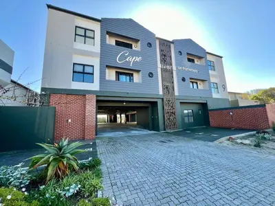 a large building with the name cafe on it at Cape on Porterfield in Cape Town