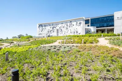 a building with a mural on the side of it at 410 Riverlands - Lux 1 bedroom Apartment in Cape Town