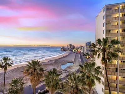 a view of the beach and a building at Sandy Shores On Beach - 709 in Strand