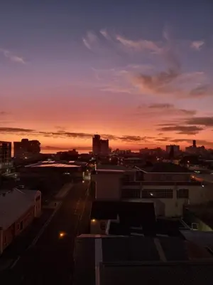 a view of a city skyline at sunset at Panorama Sea and Mountain Views in Strand