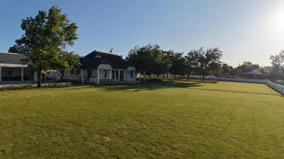 a house with a large lawn in front of it at Villa Canetsfontein in Wellington
