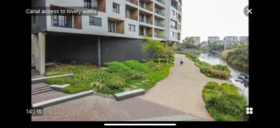 a person walking down a walkway next to a building at Waters Edge Sanctuary in Cape Town