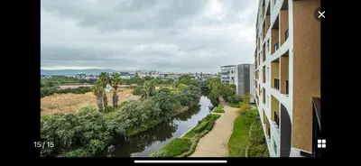 a view of a river next to a building at Waters Edge Sanctuary in Cape Town