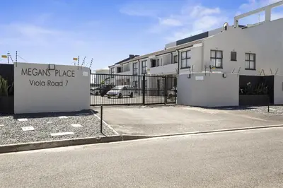 a sign that reads mexican place volvo road at 17 Megans Place in Bloubergstrand