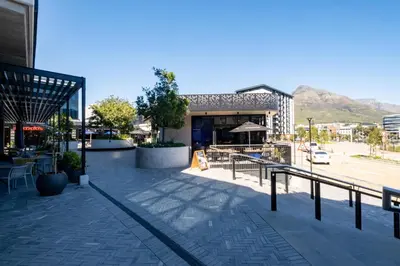 a building with a restaurant on a city street at 309 Riverlands - Lux 1 Bedroom Apartment in Cape Town