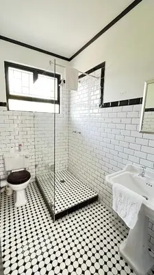 a bathroom with a shower and a toilet and a sink at Homey Central Apartment By ARPA in Stellenbosch