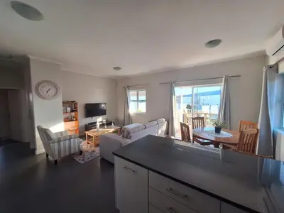 a living room with a couch and a table at Chelmsford Close Pinehurst - Excellent location! in Oakdale
