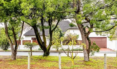 a group of trees in front of a house at Campbell's Corner in Cape Town