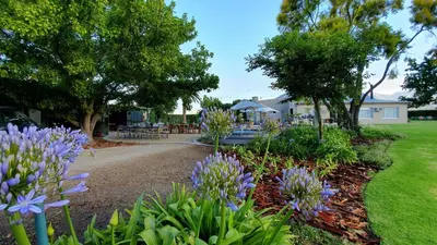 a garden with purple flowers in a yard at PicardiPlace in Rawsonville