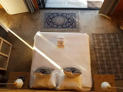 a table with two pillows on it in a room at PicardiPlace in Rawsonville