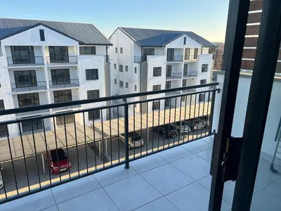 a balcony with a view of a parking lot at The black and white suite in Blackheath