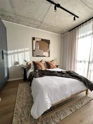 a bedroom with a large bed in a room at Riverlands 2Bedroom Apartment with Mountain Views in Cape Town