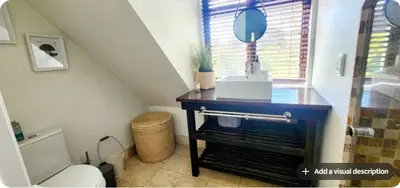 a bathroom with a sink and a toilet in a attic at Tranquil Holiday Home with Pool & Garden 4 bedrooms in Cape Town