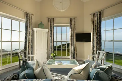 a living room with a couch and a table at The Marine Hermanus in Hermanus