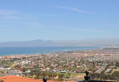 an aerial view of a city and the ocean at Blue Horizon Guest House in Gordonʼs Bay