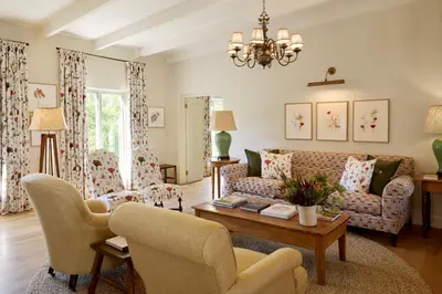 a living room with a couch and chairs and a table at Spier Hotel and Wine Farm in Stellenbosch