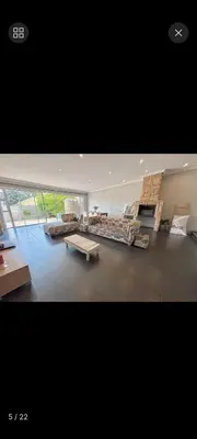 a large living room with couches and a table at S&R Guesthouse in Cape Town