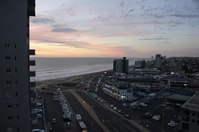 an aerial view of a city with the ocean at Luxurious 3-bedroom Bloubergstrand Cape Town beachfront apartment with stunning sea and beach view in Cape Town