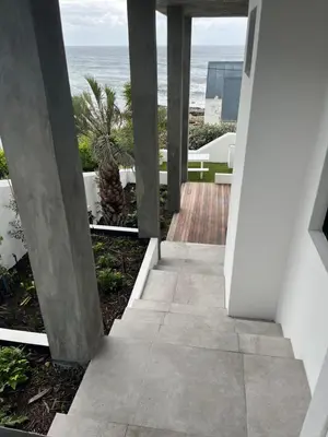 a view of the ocean from the hallway of a house at Apartment Dolphin House in Hermanus