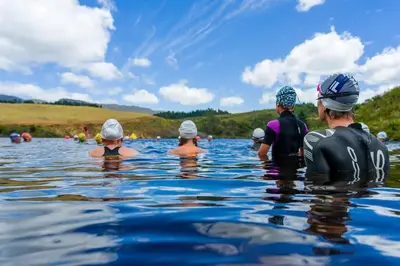 a group of people swimming in the water at Elgin River Lodge in Elgin