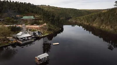 an aerial view of a river with a boat in it at Elgin River Lodge in Elgin