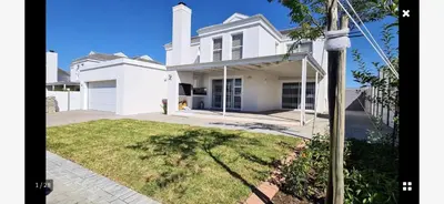 a white house with a driveway and a yard at 53 hillcrest in Oakdale