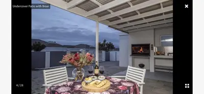 a dining room table with a vase of flowers on it at 53 hillcrest in Oakdale