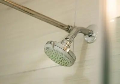 a shower with a shower head in a bathroom at Sonvanger Studio at Andringa Mall Luxury Apartments in Stellenbosch