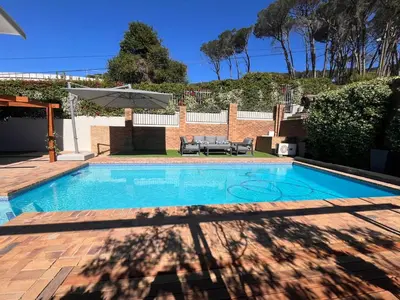 a swimming pool in the backyard of a house at 18 On Louvre Guesthouse in Paarl