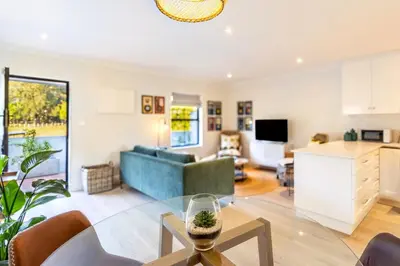 a living room with a couch and a table at Tram Vibes in Franschhoek