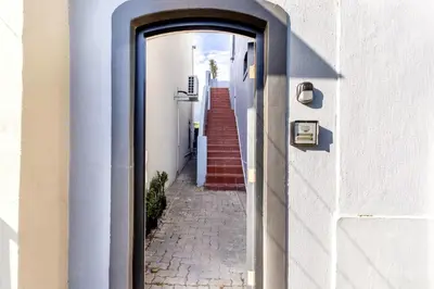 an alleyway with a door leading into a building at Tram Vibes in Franschhoek
