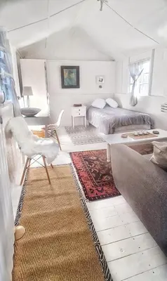 a living room with a bed and a couch at Oh so Heavenly in Cape Town