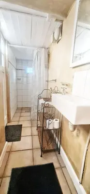 a bathroom with a sink and a white sink at Oh so Heavenly in Cape Town