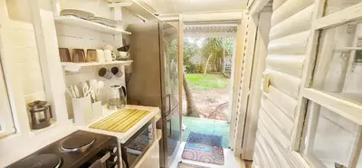 a small kitchen with a sink and a refrigerator at Oh so Heavenly in Cape Town