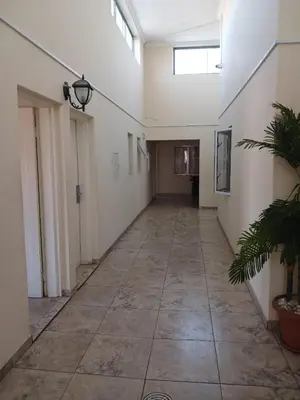 an empty hallway of a building with a large room at Lookout Star Legend Accommodation in Parow