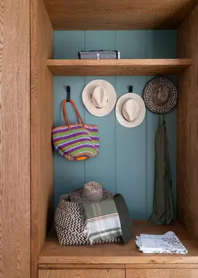 a wooden shelf with hats and bags on it at 6 on Heide in Franschhoek