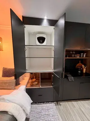 a room with a bed and a black wall at Little Heaven in Cape Town