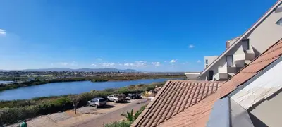 a view of a river from the roof of a house at Studio Apartment - Dolphin Beach in Cape Town