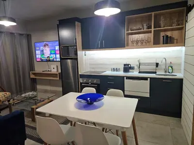 a kitchen with a white table with a blue bowl on it at PinotageLuxuryCollection 14 Bastmolen in Stellenbosch