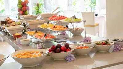 a buffet of fruits and vegetables on a table at Le Franschhoek Hotel & Spa by Dream Resorts in Franschhoek